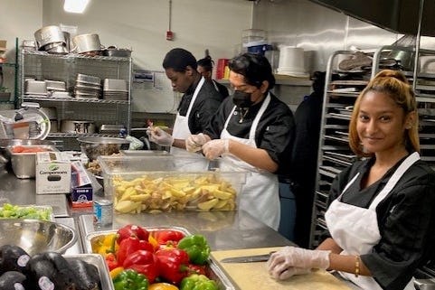 The Door's culinary chefs preparing meals for BSA and The Door.