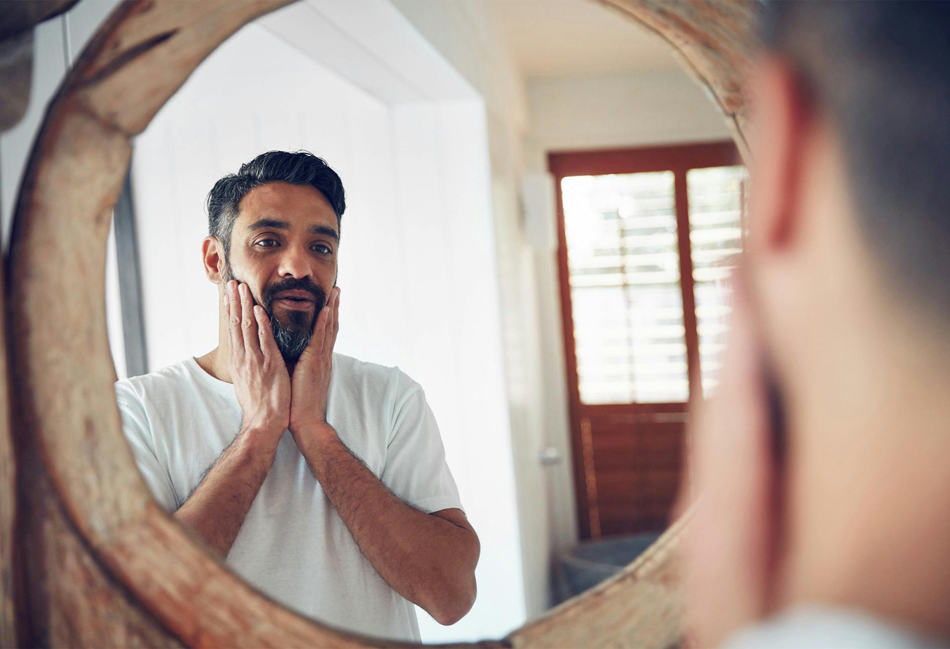 Man looking in a mirror