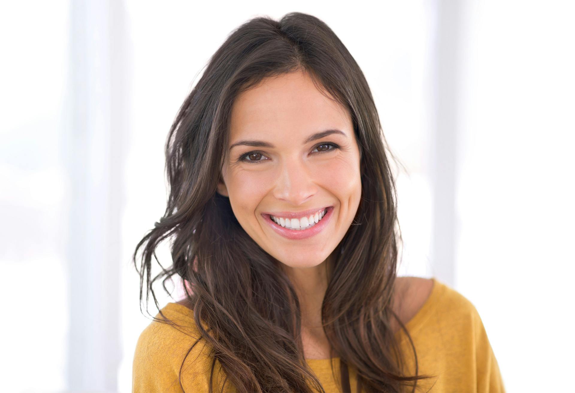 Woman with a yellow shirt on