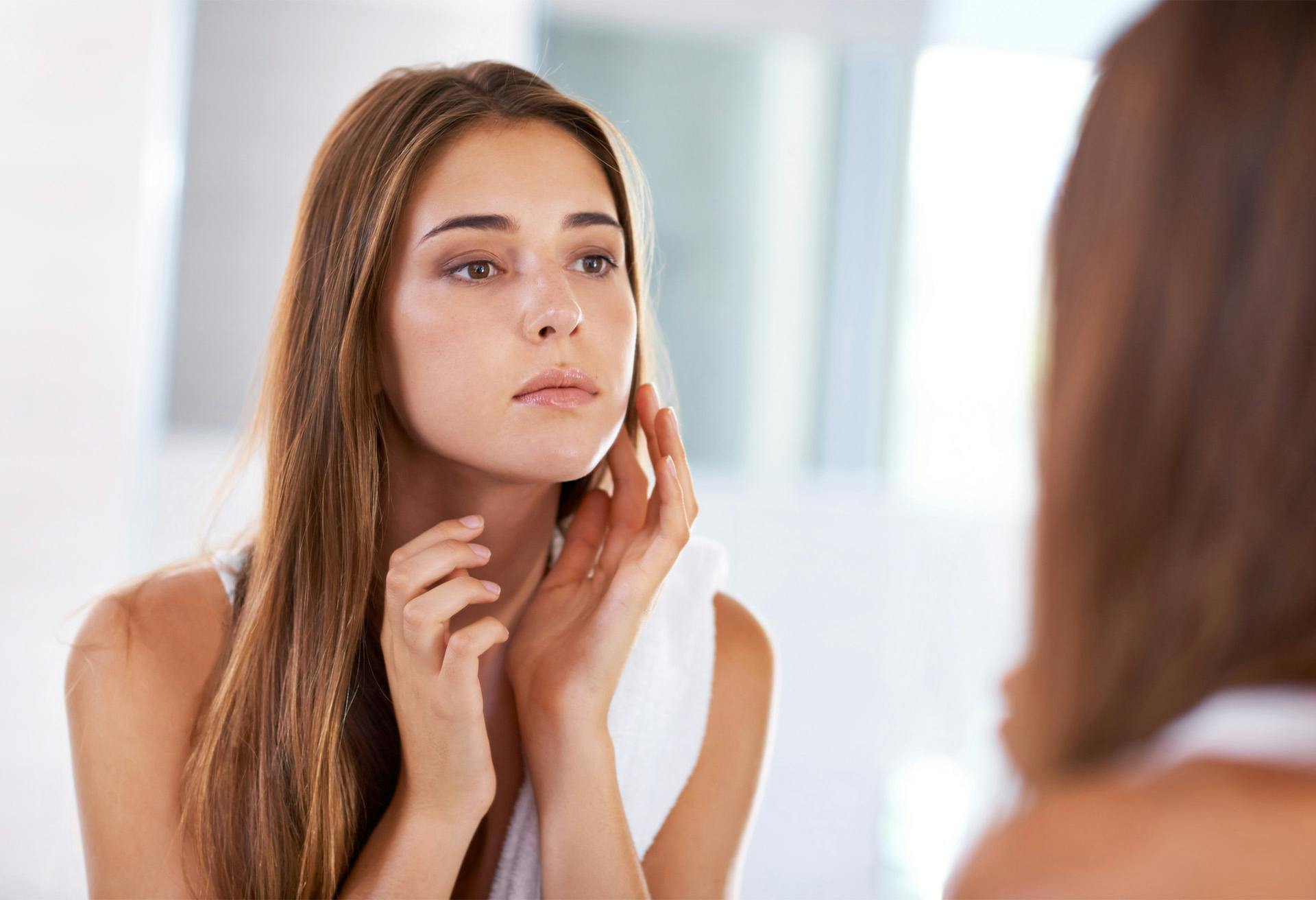 Woman looking into the mirror