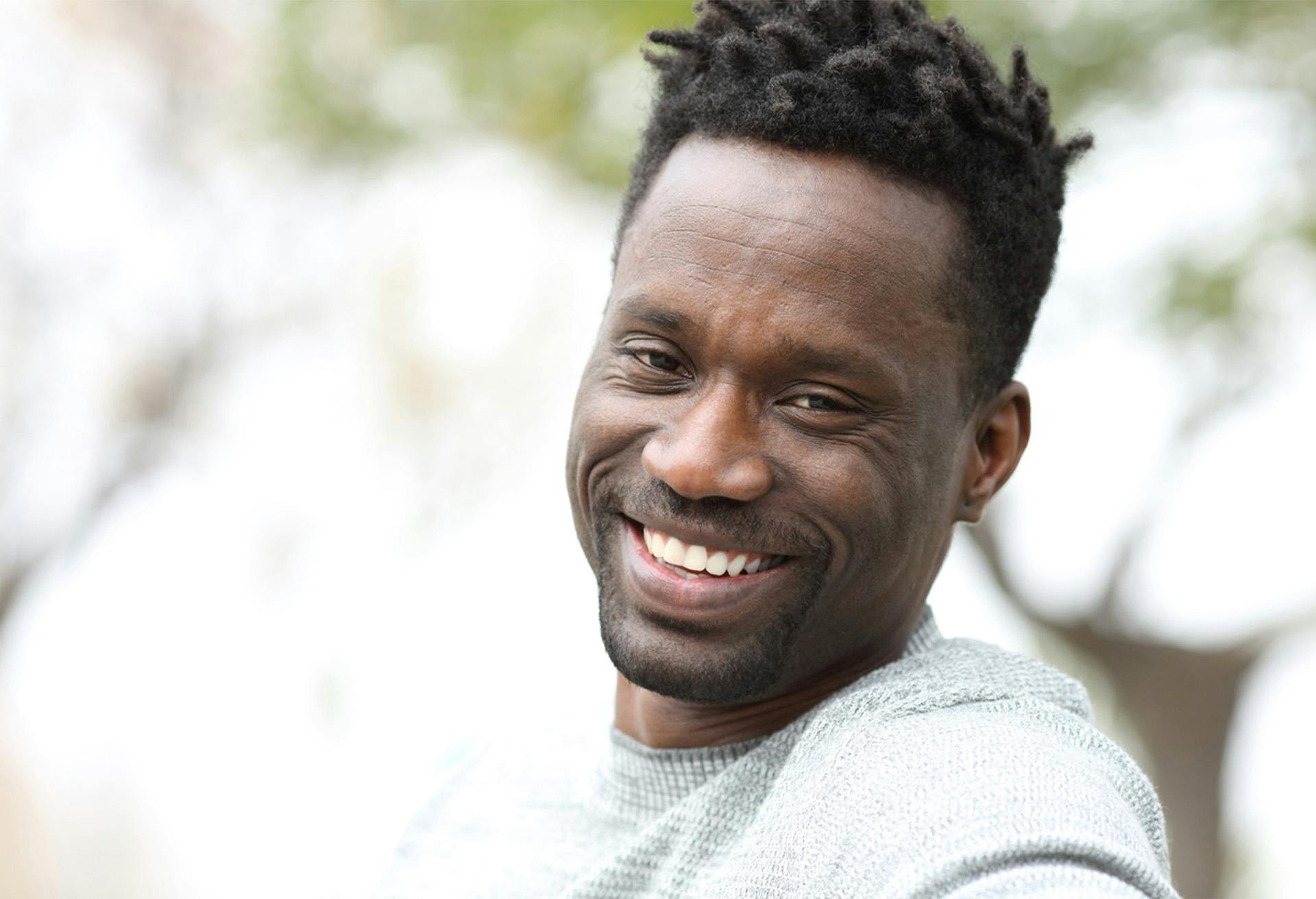 An African American man smiling