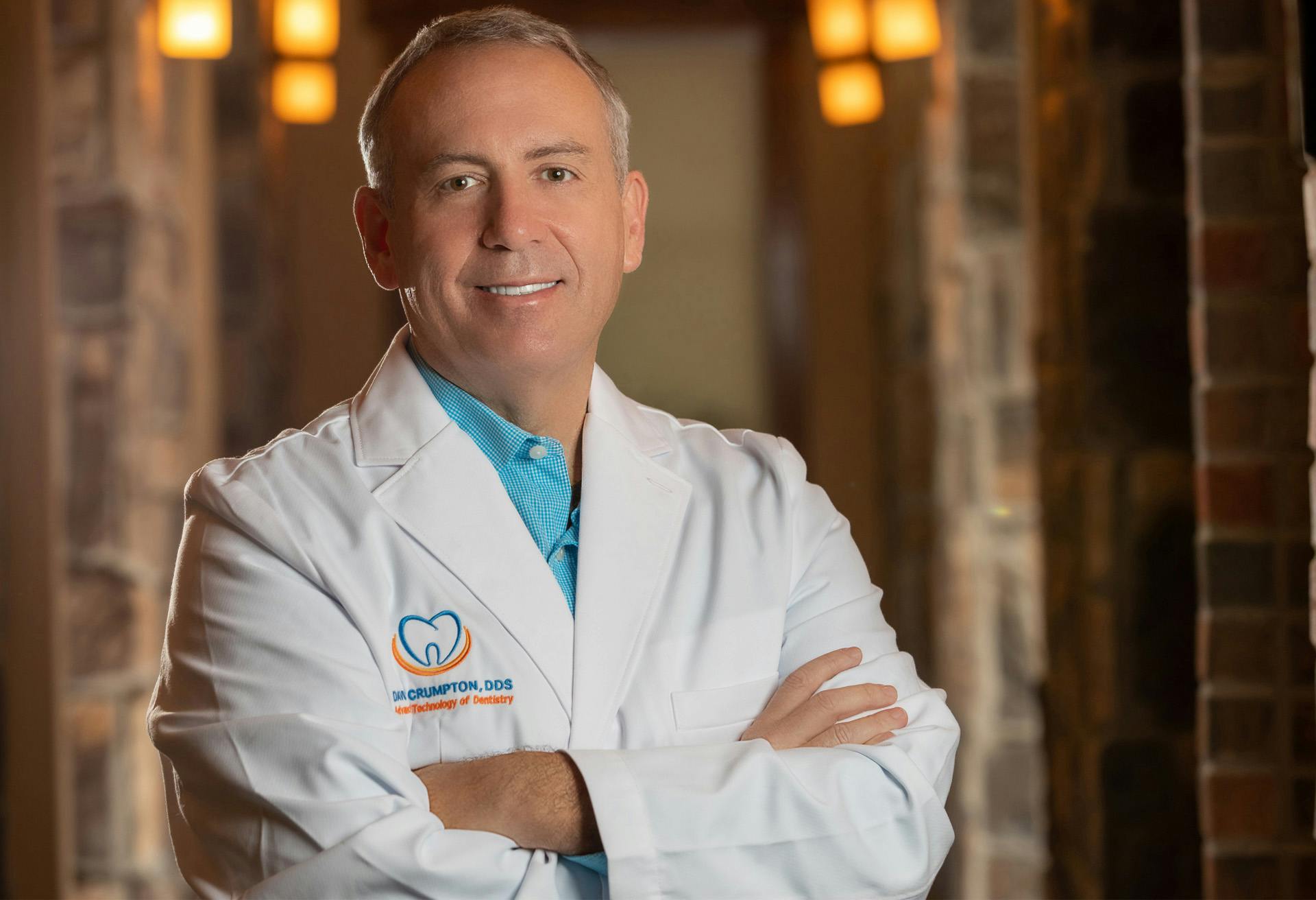 Dr. David Crumpton posing with his arms crossed