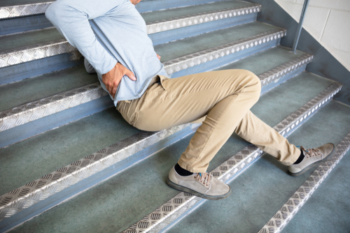 A man has injured his back after falling down some stairs.