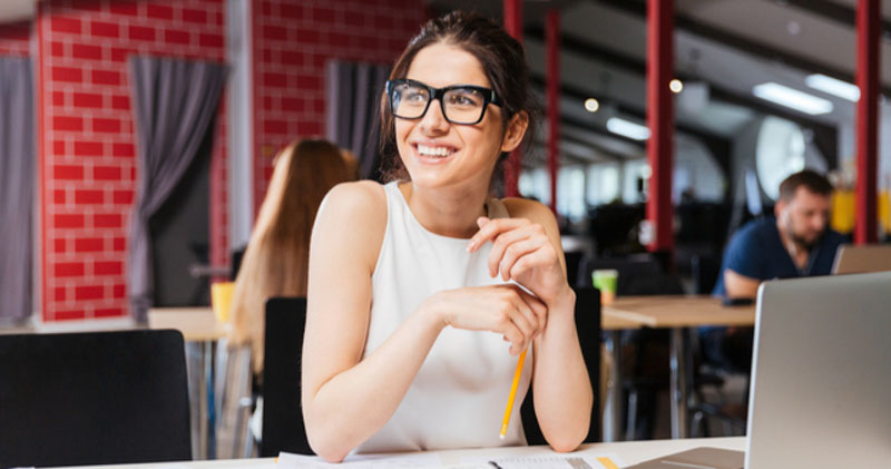 impressed female office worker works in coworking space