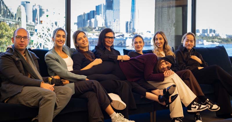 interior designer lorena gaxiola reclines with team in harbourside sydney office