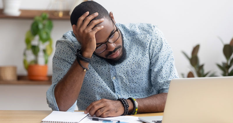 young male corporate worker is upset at dismissal