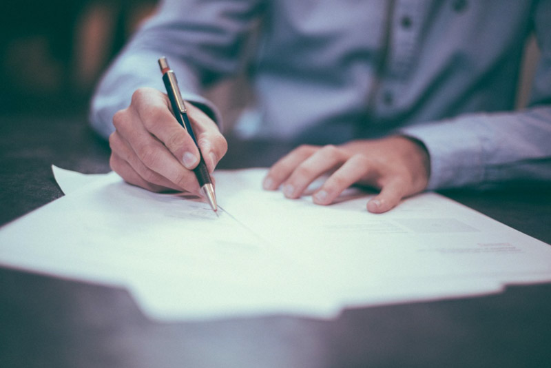 man signs deed of release