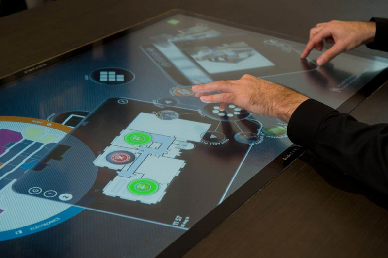 hands controlling blueprint touchscreen