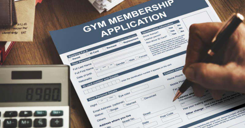 Male hand filling out gym application