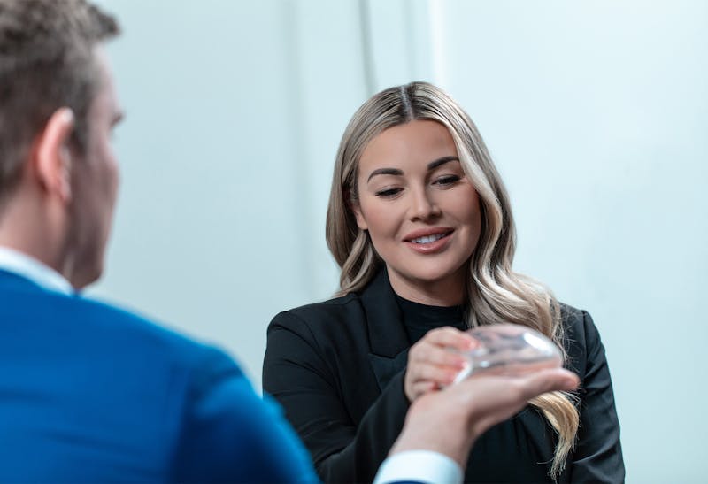 Woman examining a breast implant