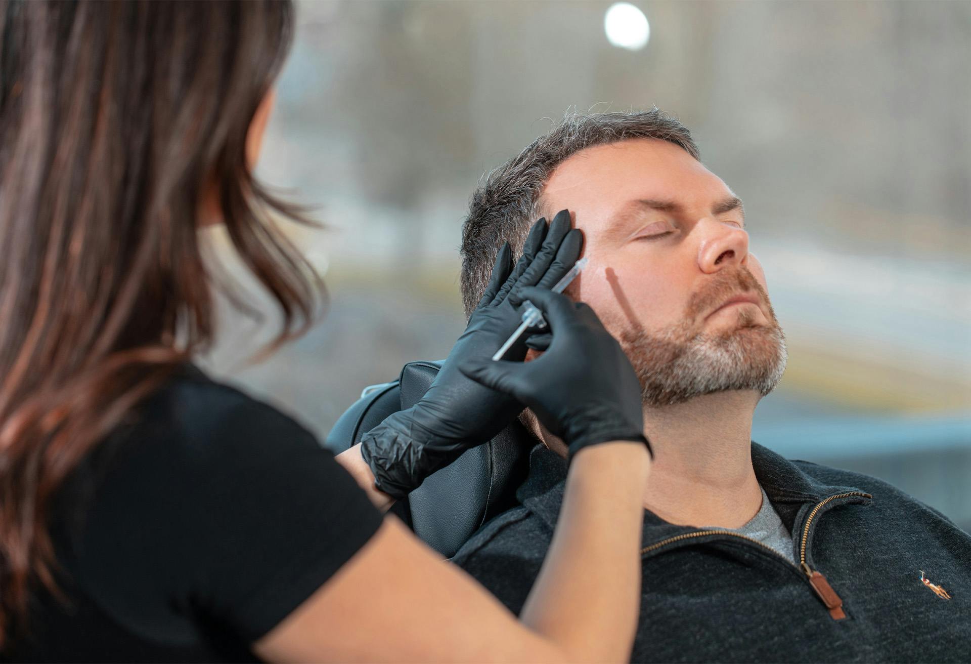 Male patient receiving injectable fillers