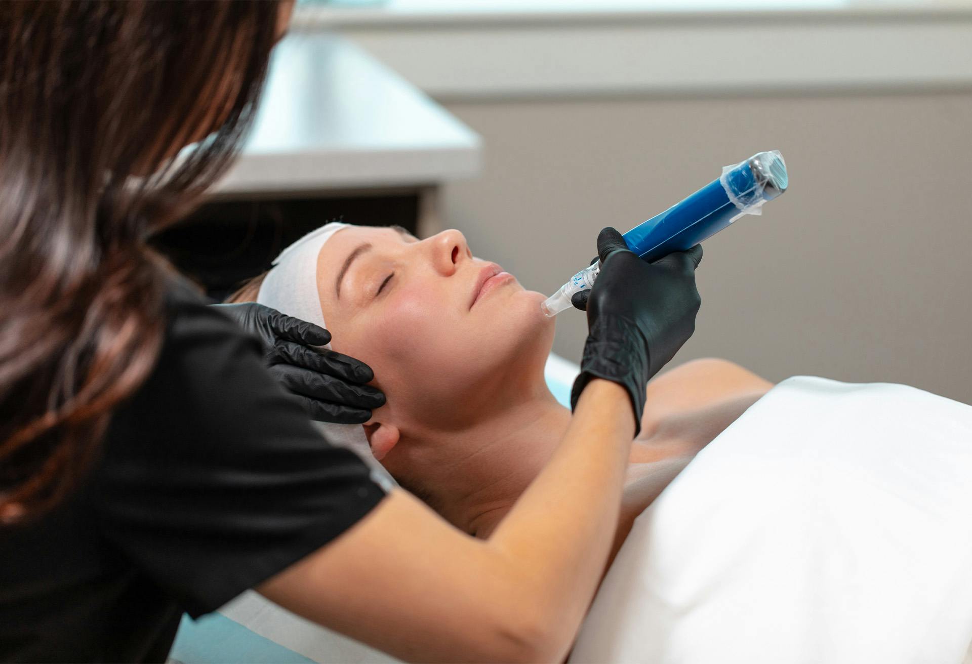 woman undergoing non-surgical face procedure