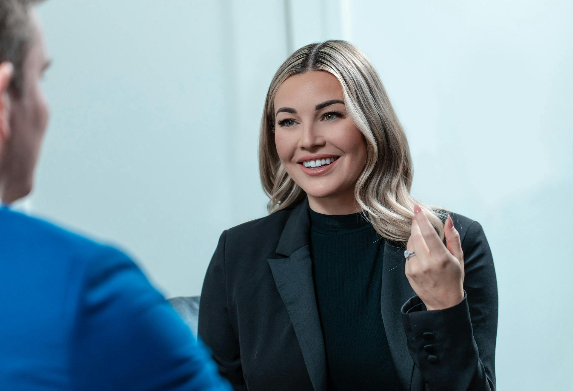 A blonde woman meeting with Dr. Gardenier