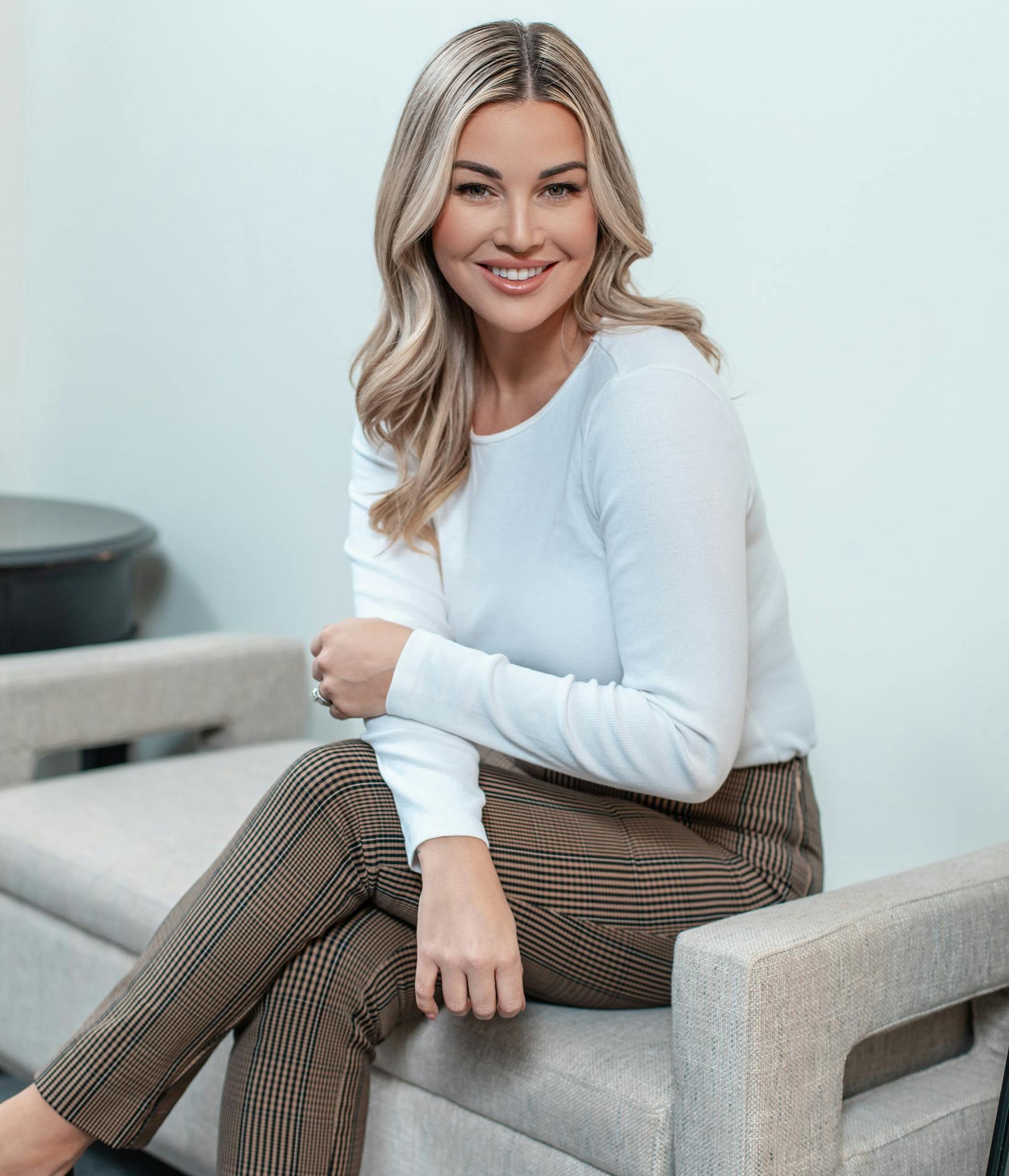 Blonde woman sitting on a bench