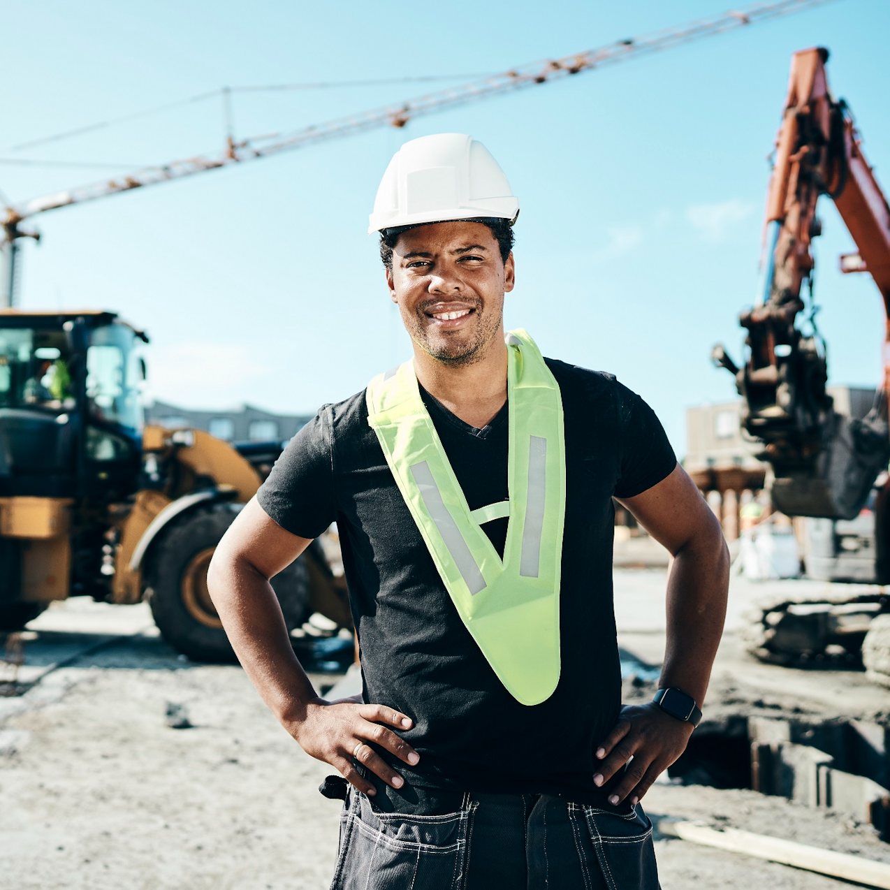 Construction worker in safety hat and high vis on construction site