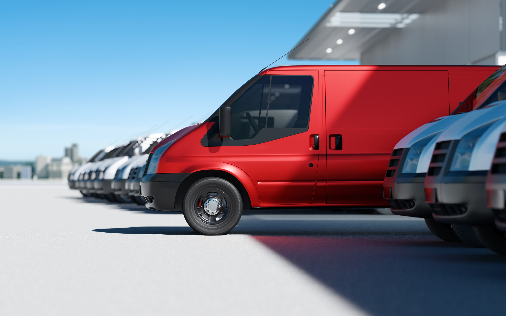 Red van and white vans in a row