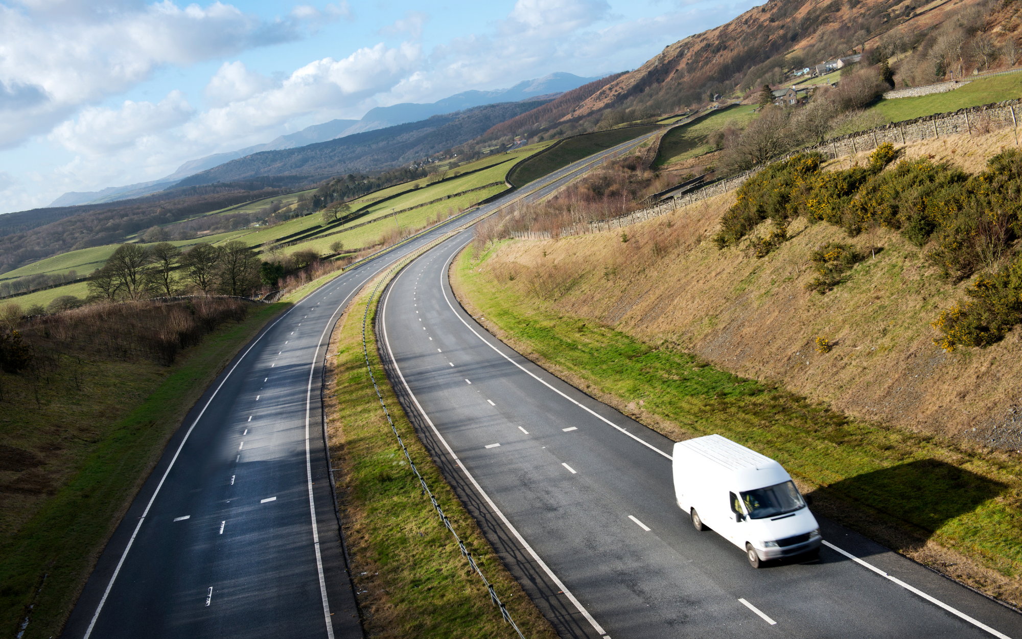 White van on road in UK countryside