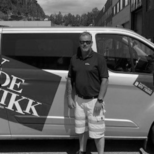 Worker in front of silver van