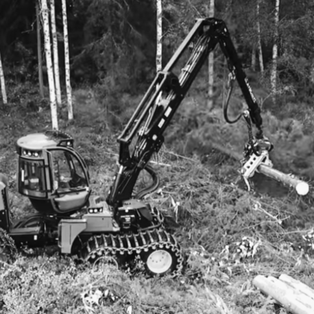 Machine picking up timber