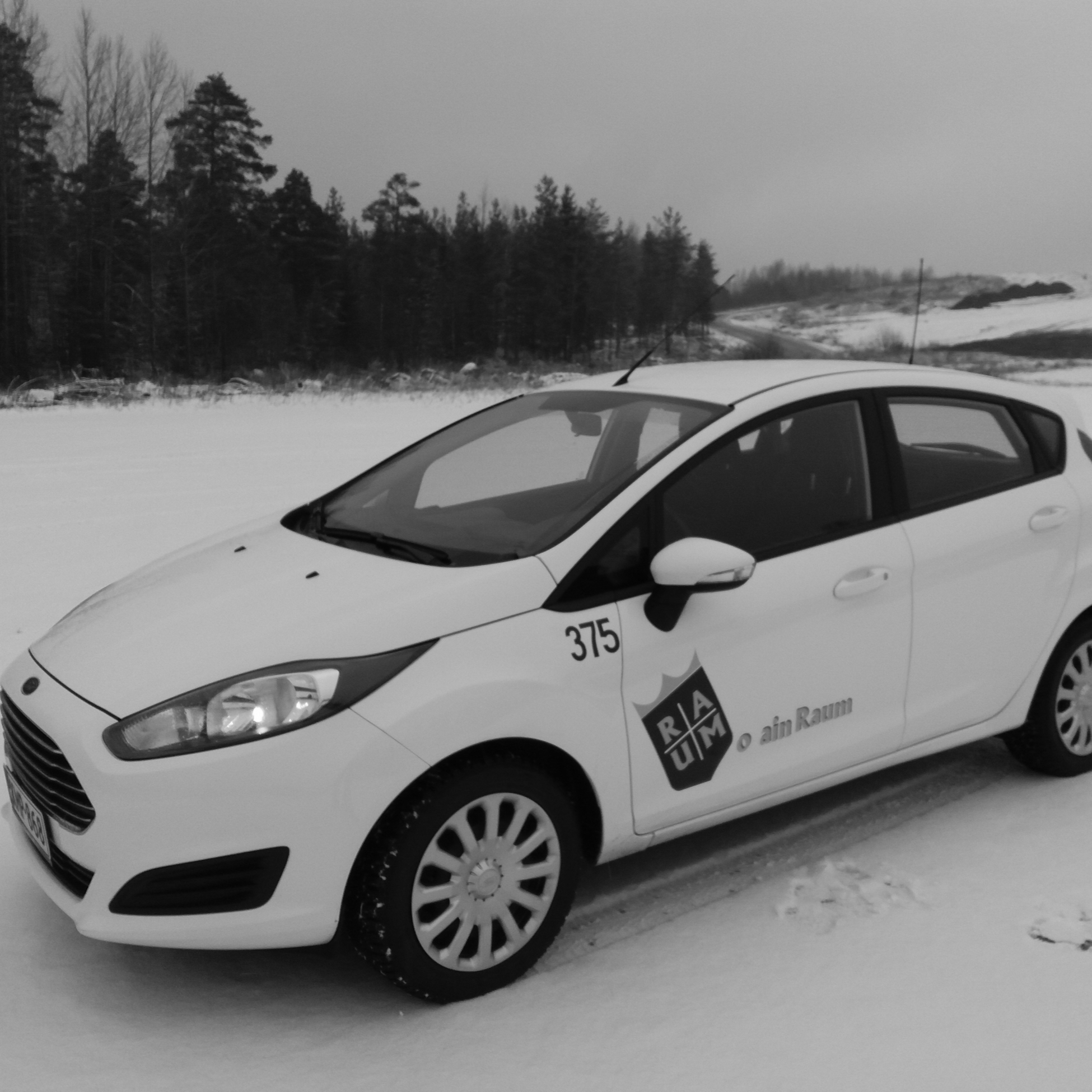 white car in the snow