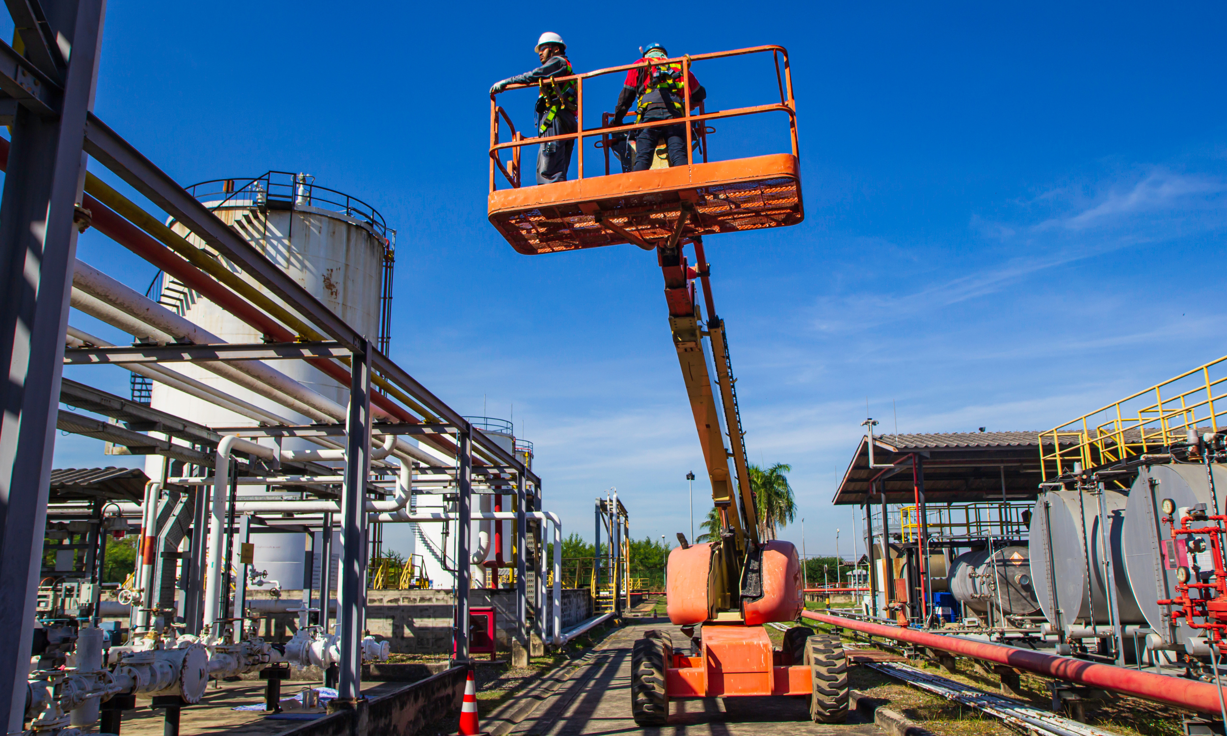 people in lift on construction site