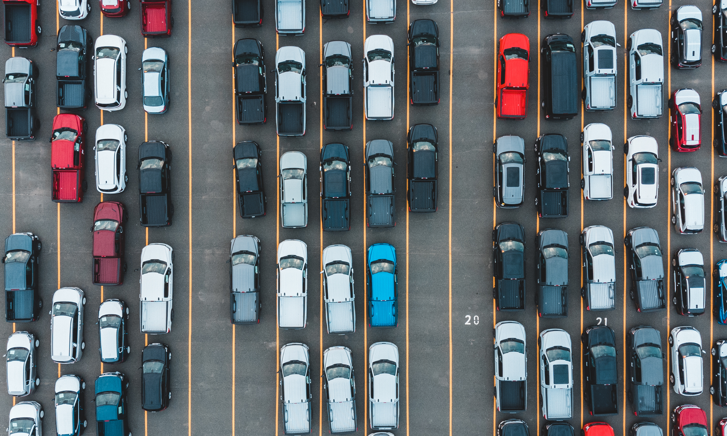 many cars filling a parking lot