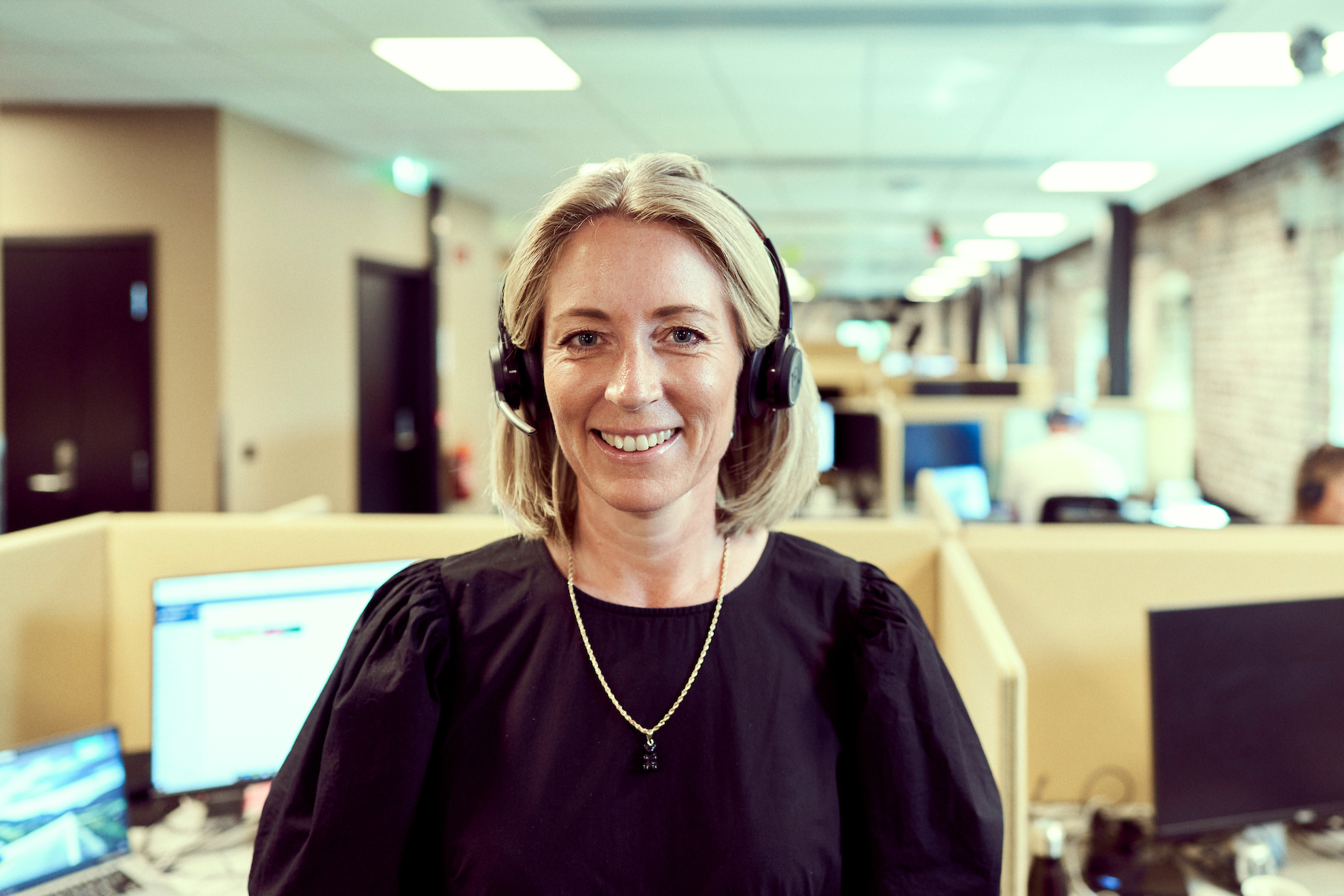 woman with headset in office environment