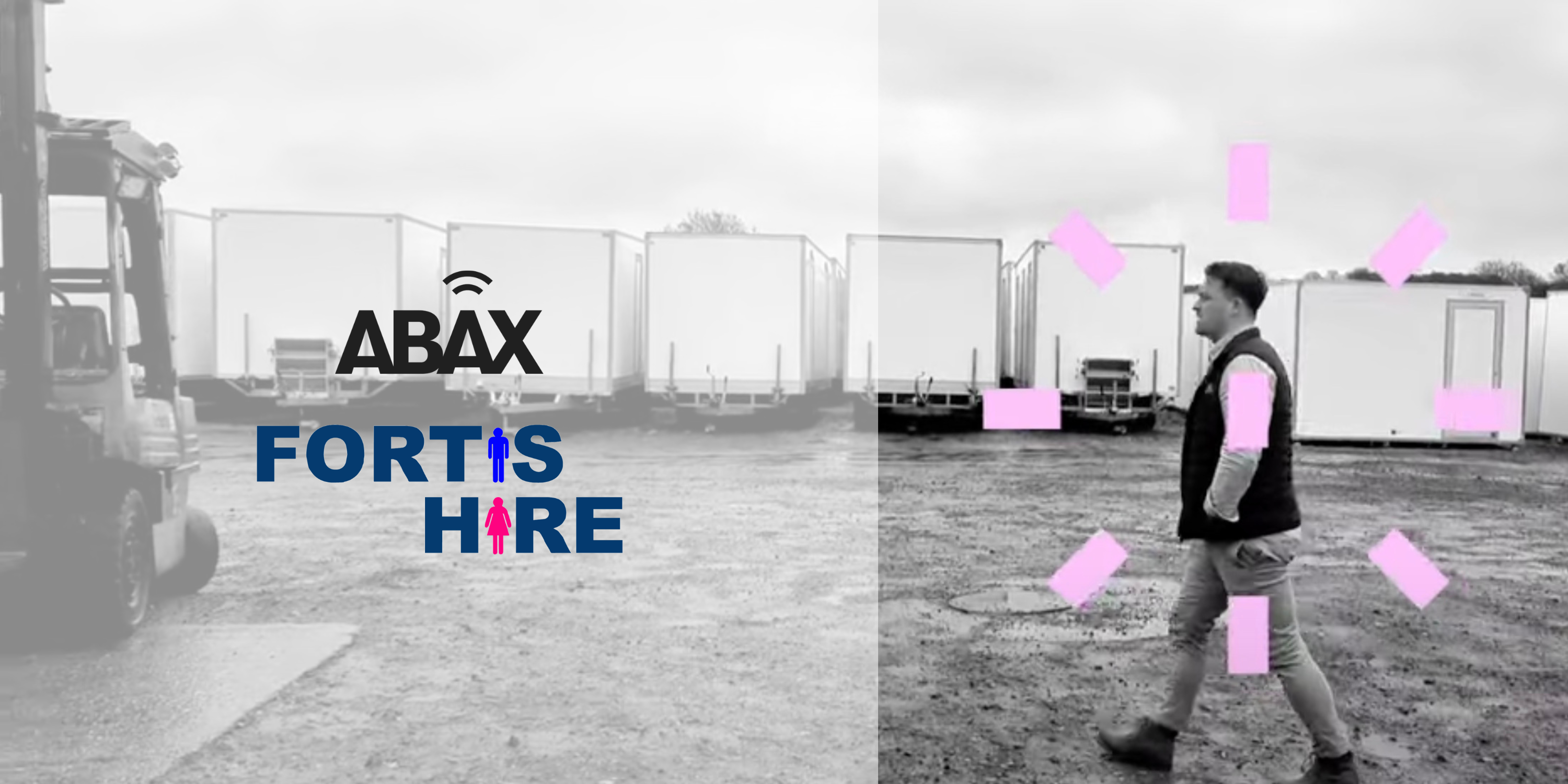 Black and white picture showing company owner walking through yard with ABAX and Fortis Hire logos