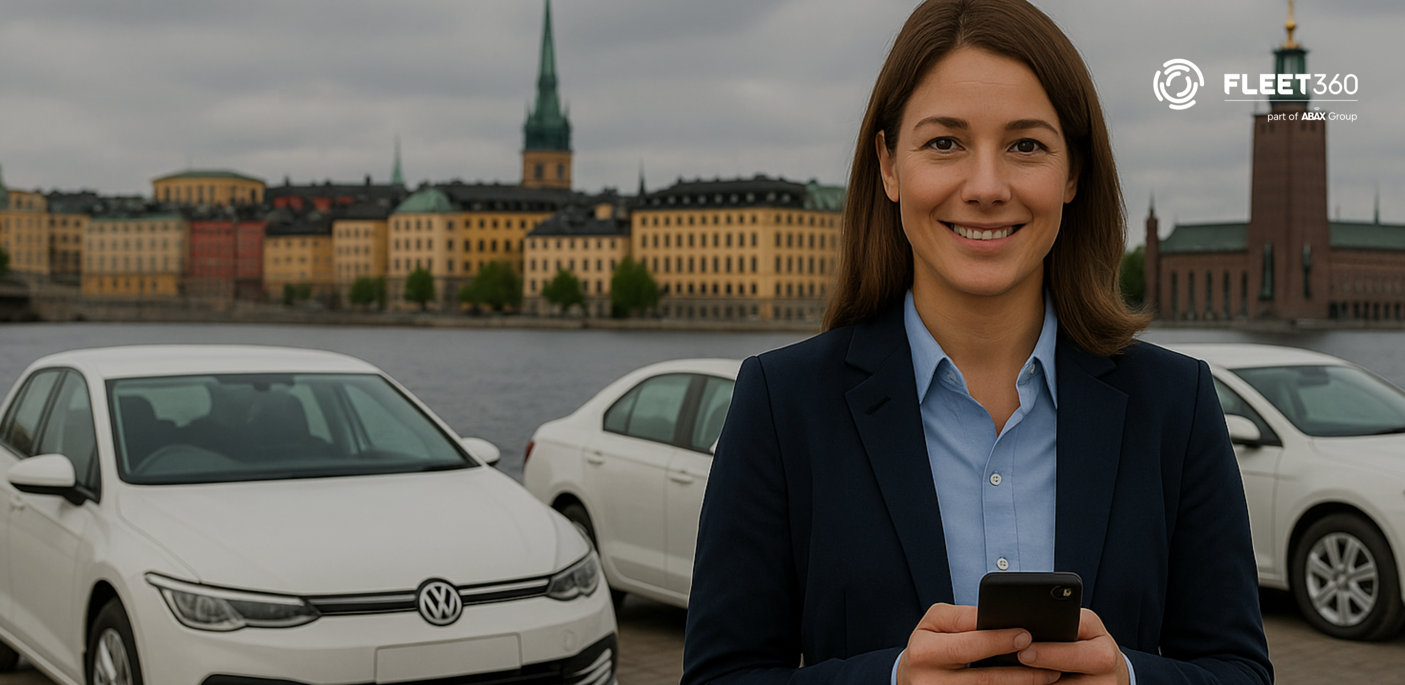 Woman managing fleet on phone in front of white cars