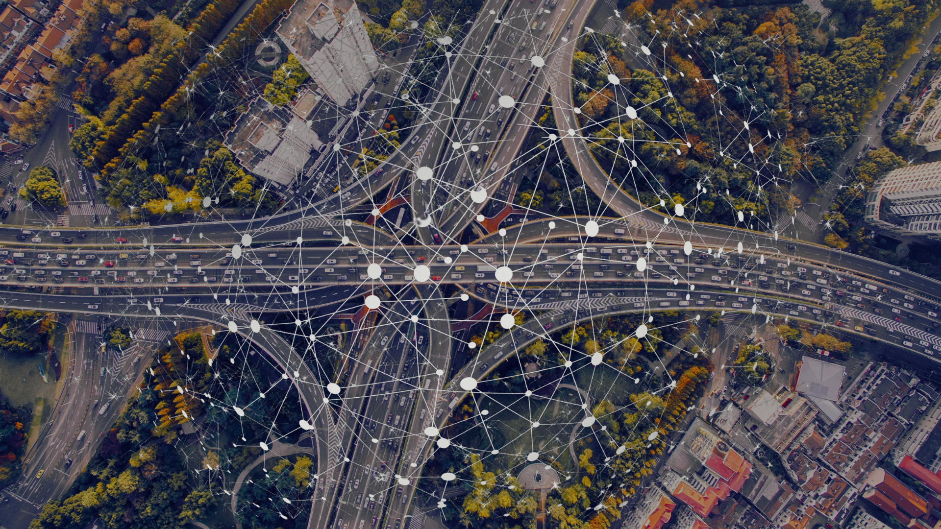Aerial view of roads and trees with network web overlay