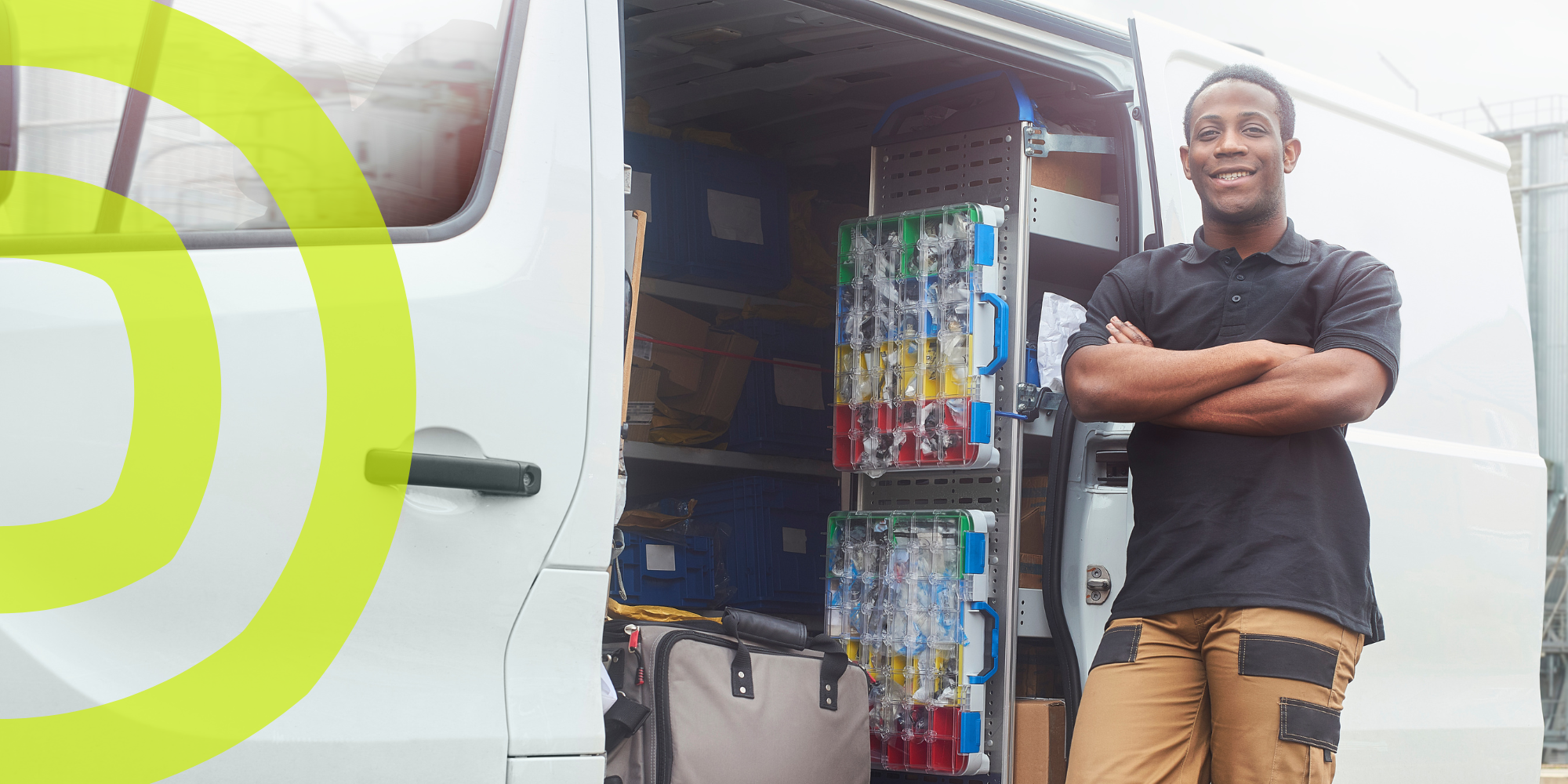 Plumber standing in front of open van