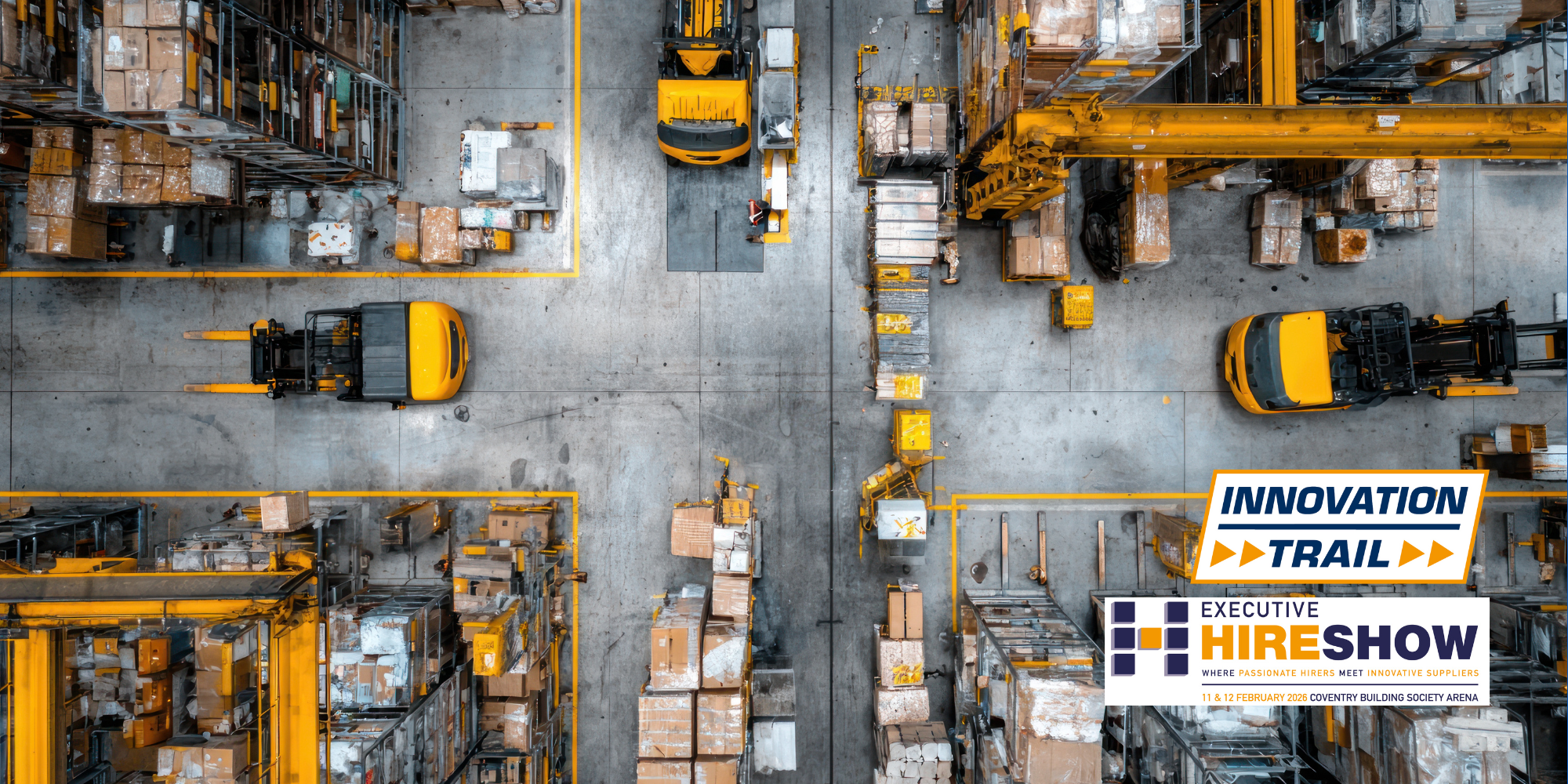 Birdseye view of a warehouse with forklifts and boxes and the Executive Hire Show logo and Innovation Trail logo