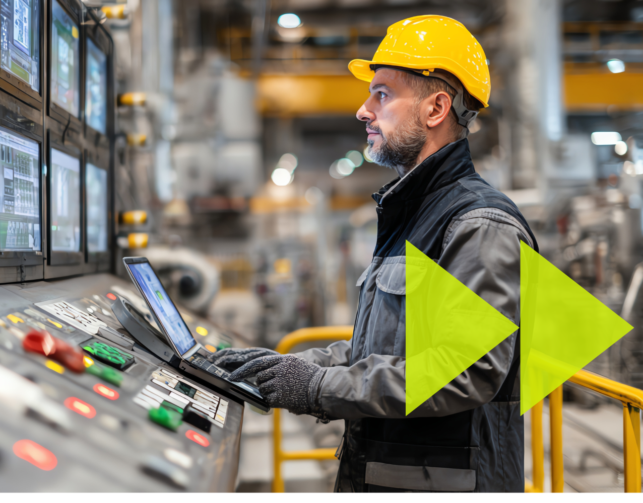 Man in hard hat on site looking at laptop and screens in a manufacturing environment with green arrows graphic overlayed.