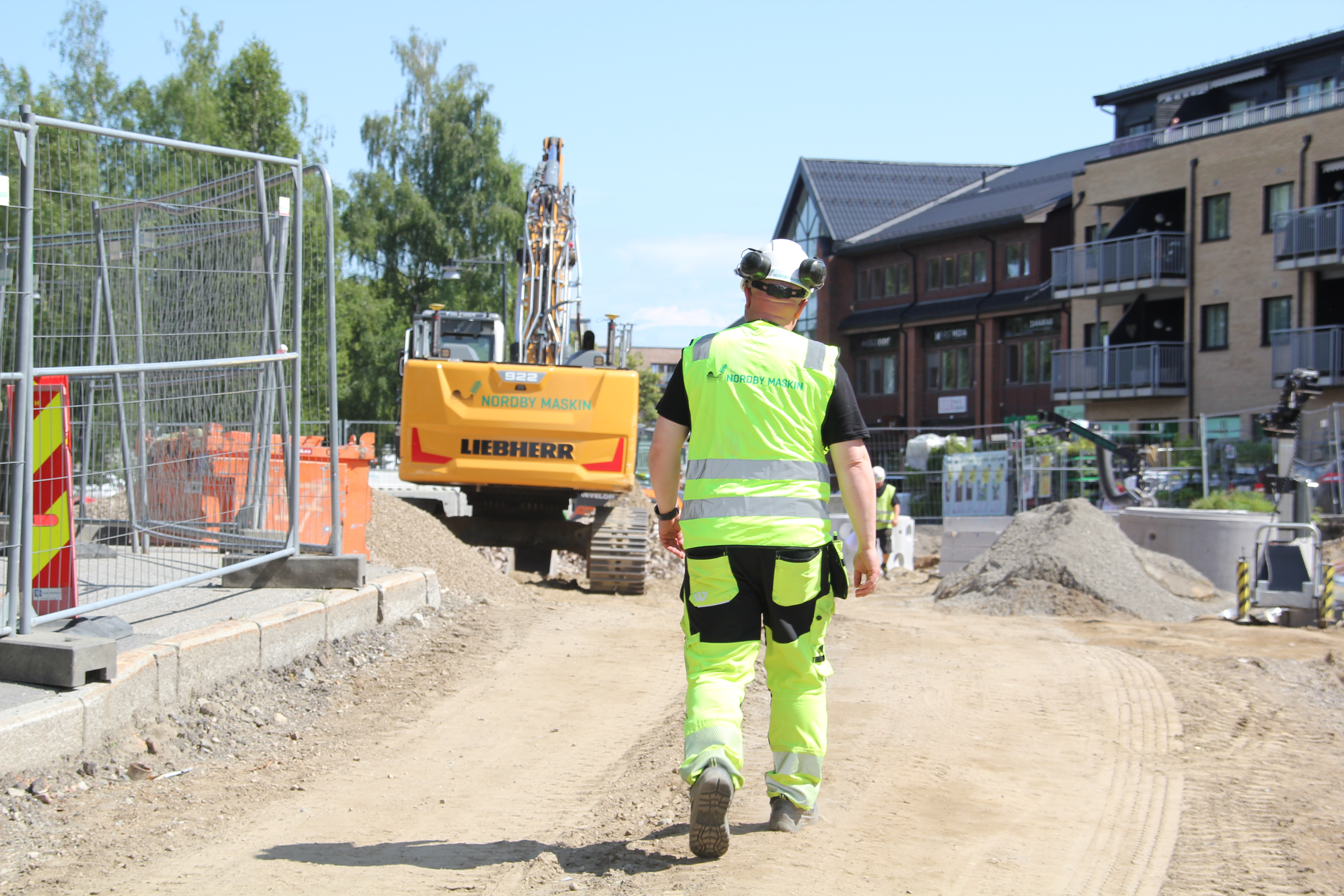 Nordby Maskin man walking on building site