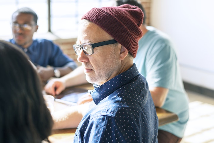 Person with low vision at meeting