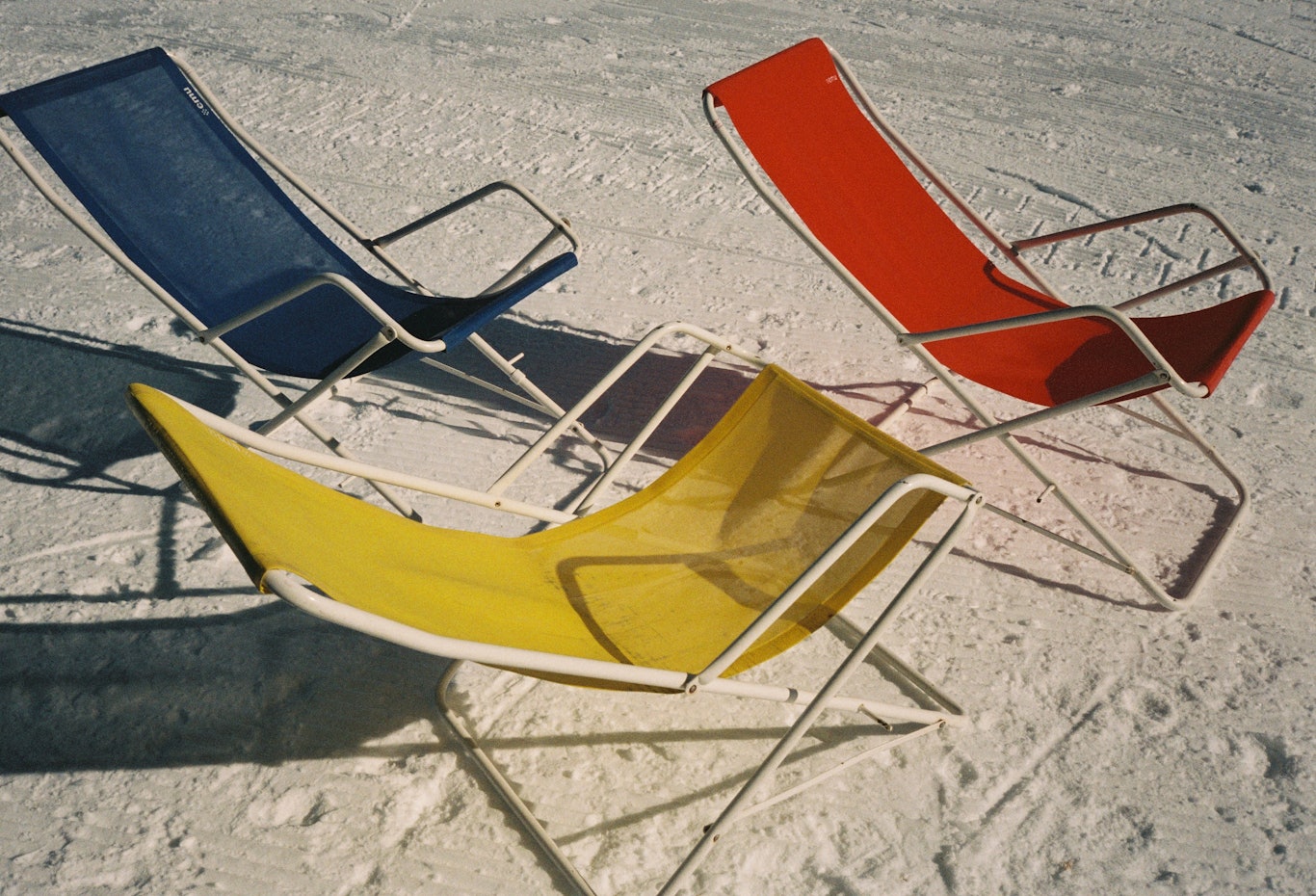 Red, yellow and blue sunloungers © Arturo + Bamboo