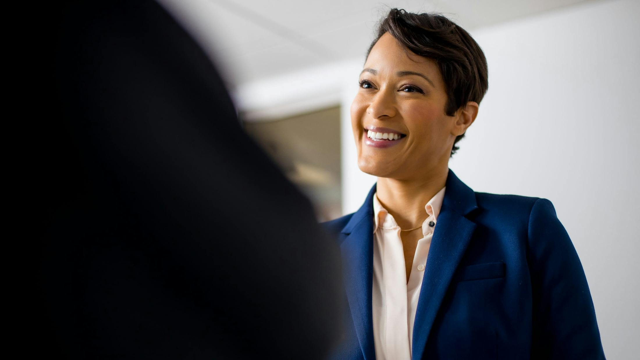 Woman in a suit smiling