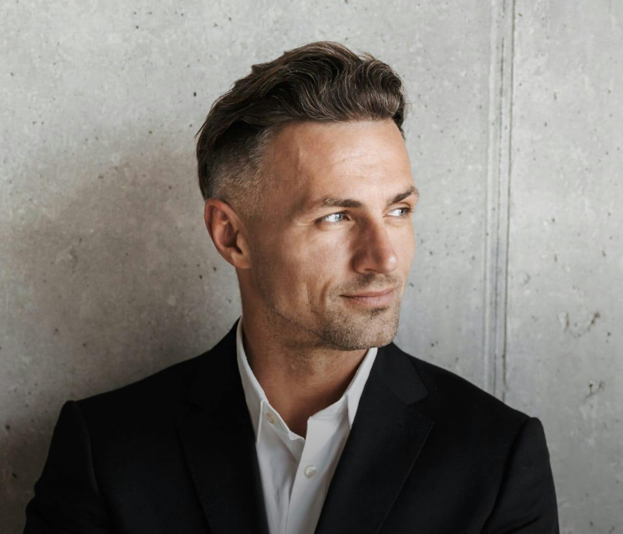 Handsome man with salt and pepper hair wearing a suit