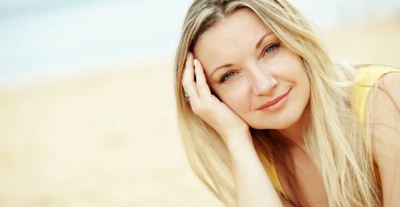 Woman on the Beach with her Hand in Her Hair
