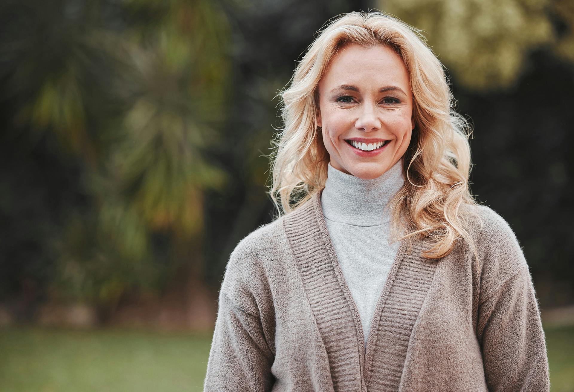 Woman Smiling with Sweater