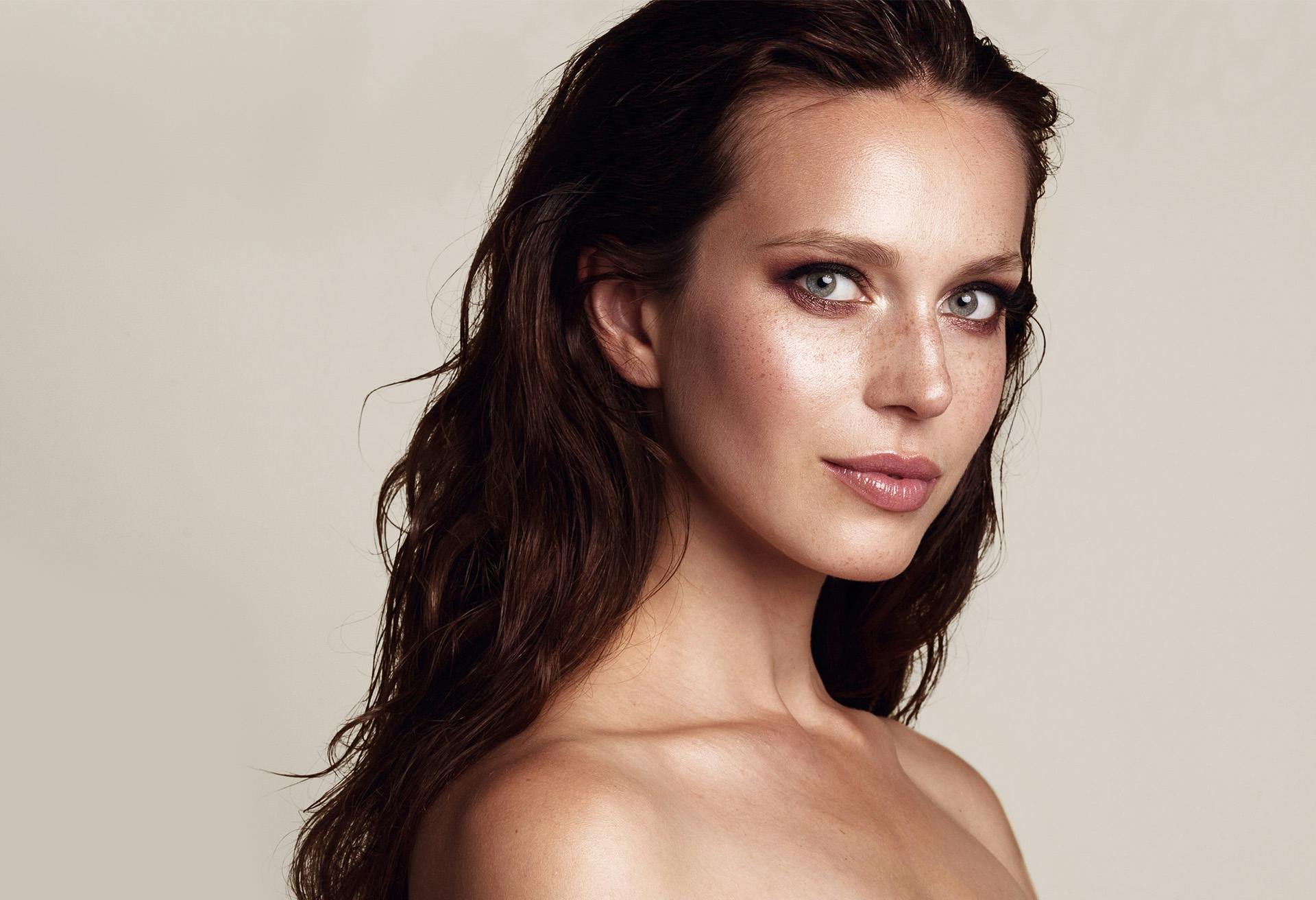Woman with Bare Shoulders looking at the Camera