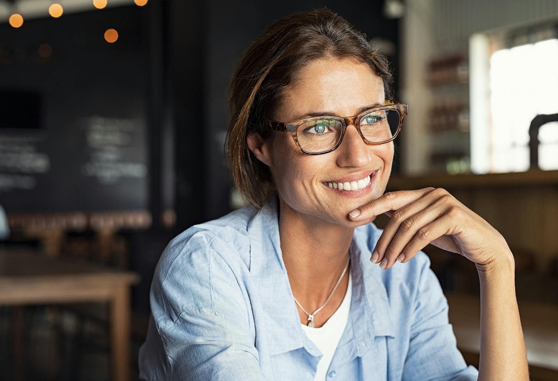 Woman with Glasses Smiling
