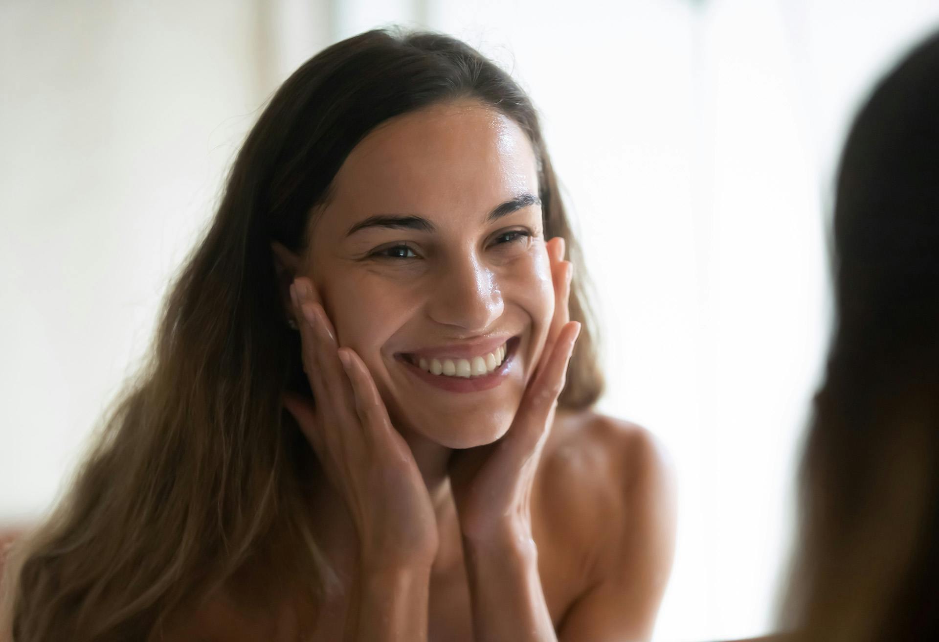 Woman Smiling in the Mirror