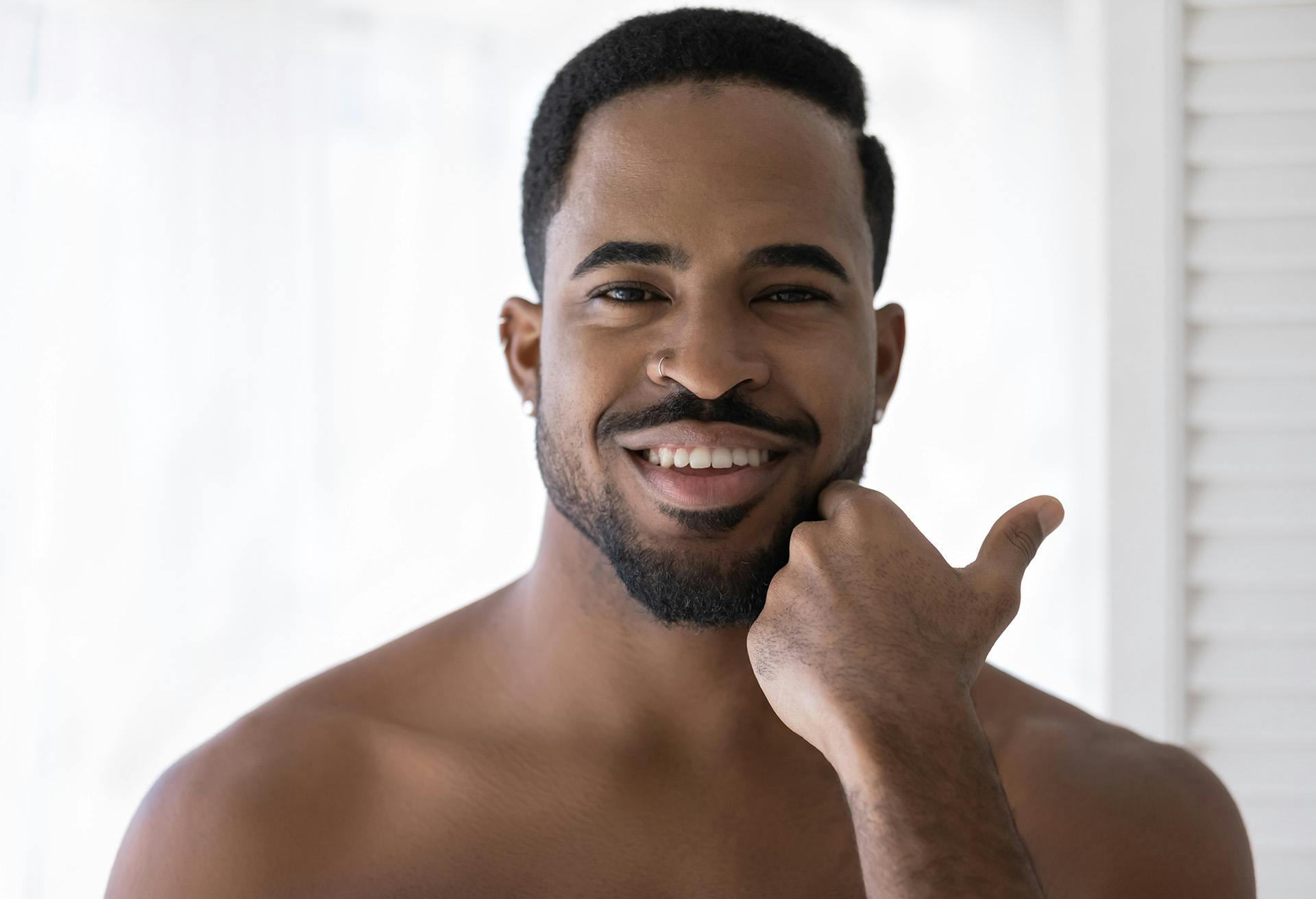 Man Touching His Beard