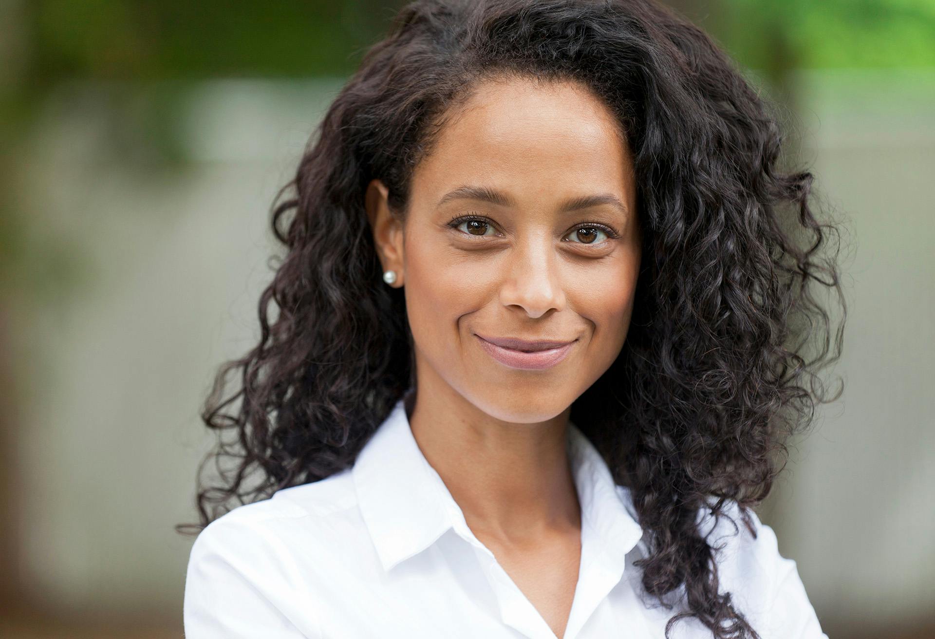 Woman with Hair Parted to the Side looking at the Camera