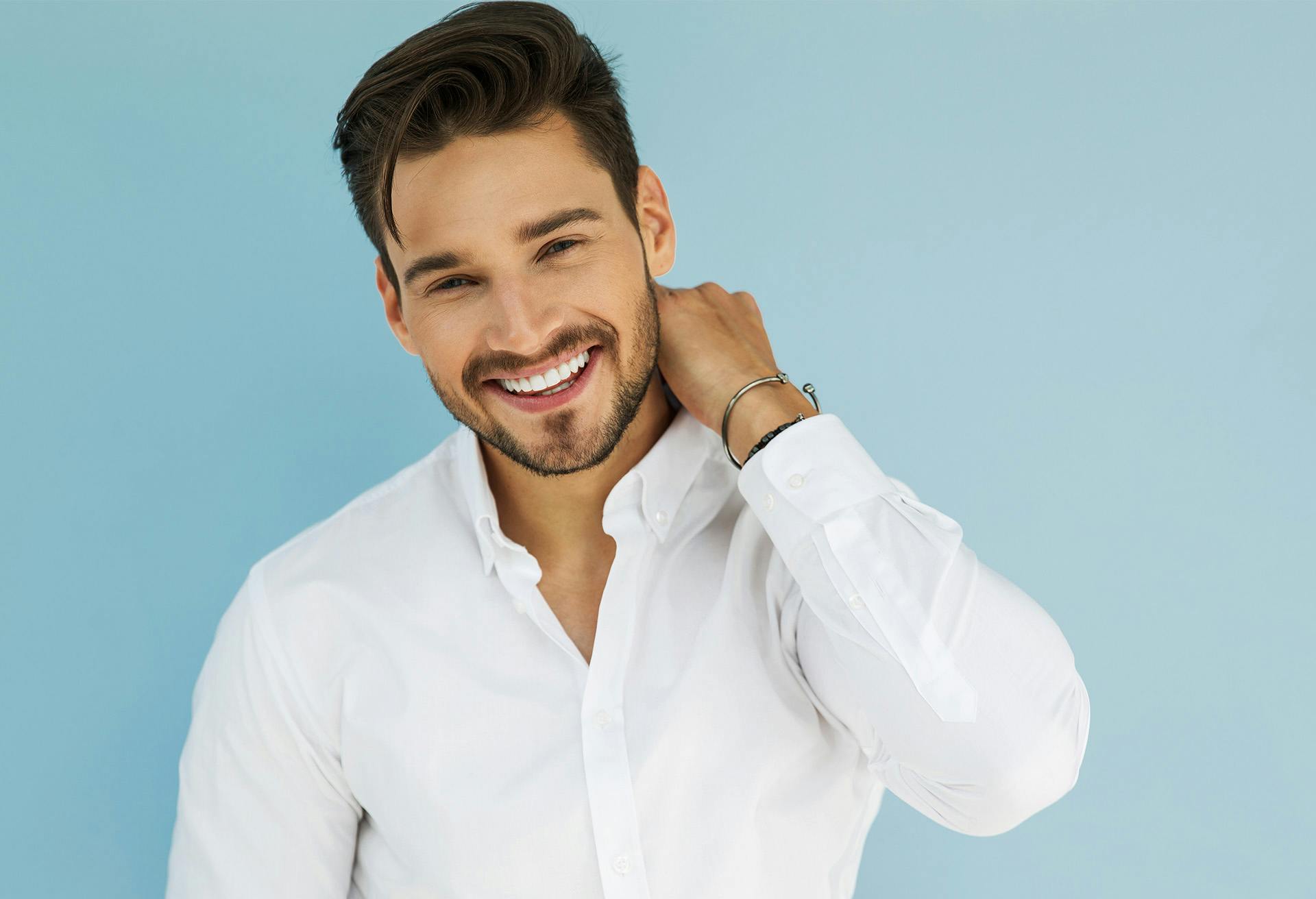 Man with Smiling with White Shirt and Blue Background