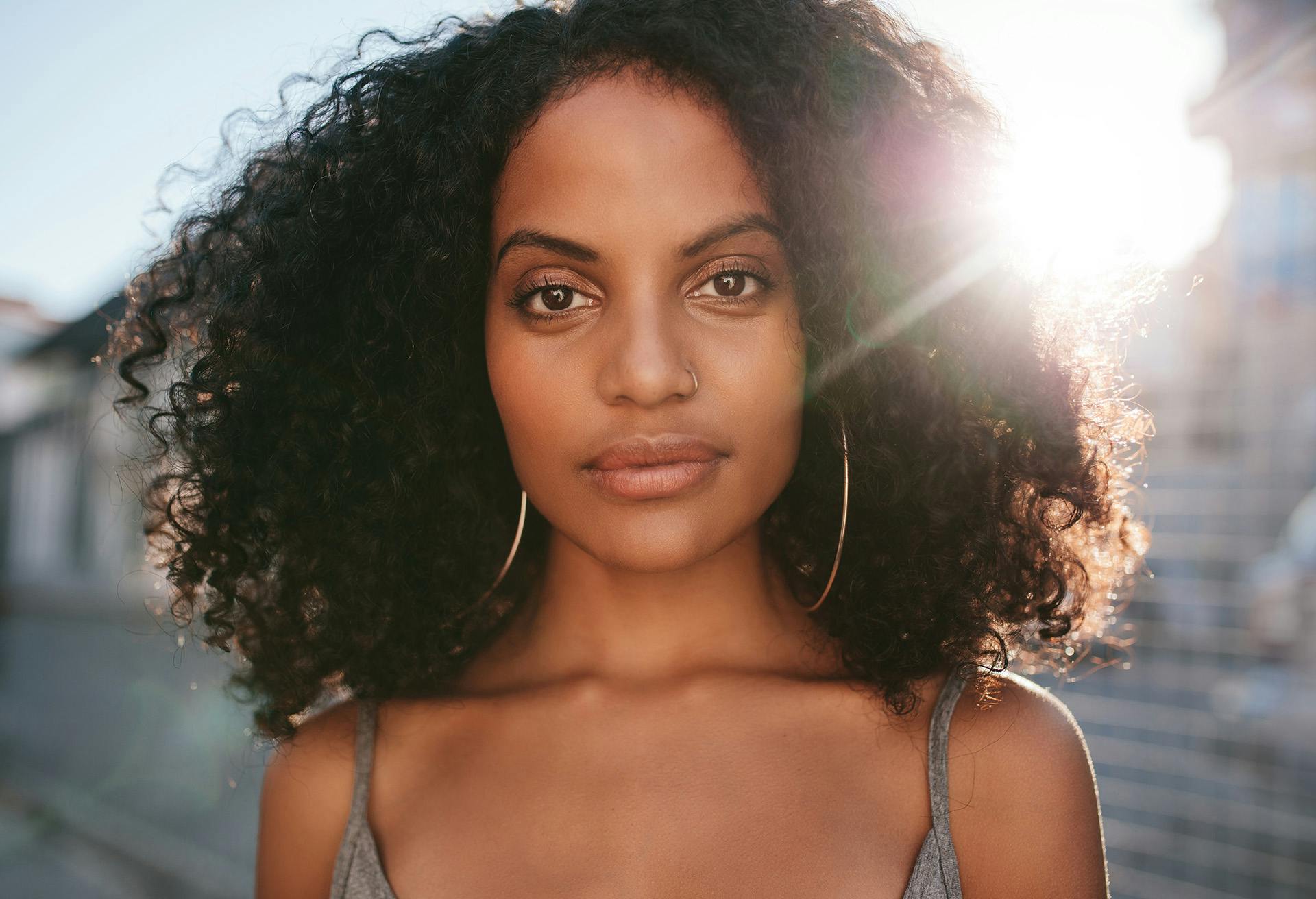 Woman's Face with the Sun Light Behind Her