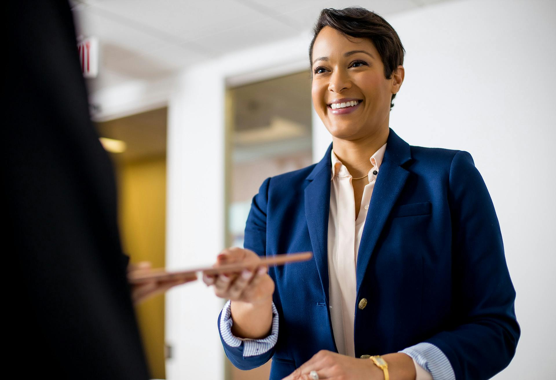 Woman Handing Someone Something