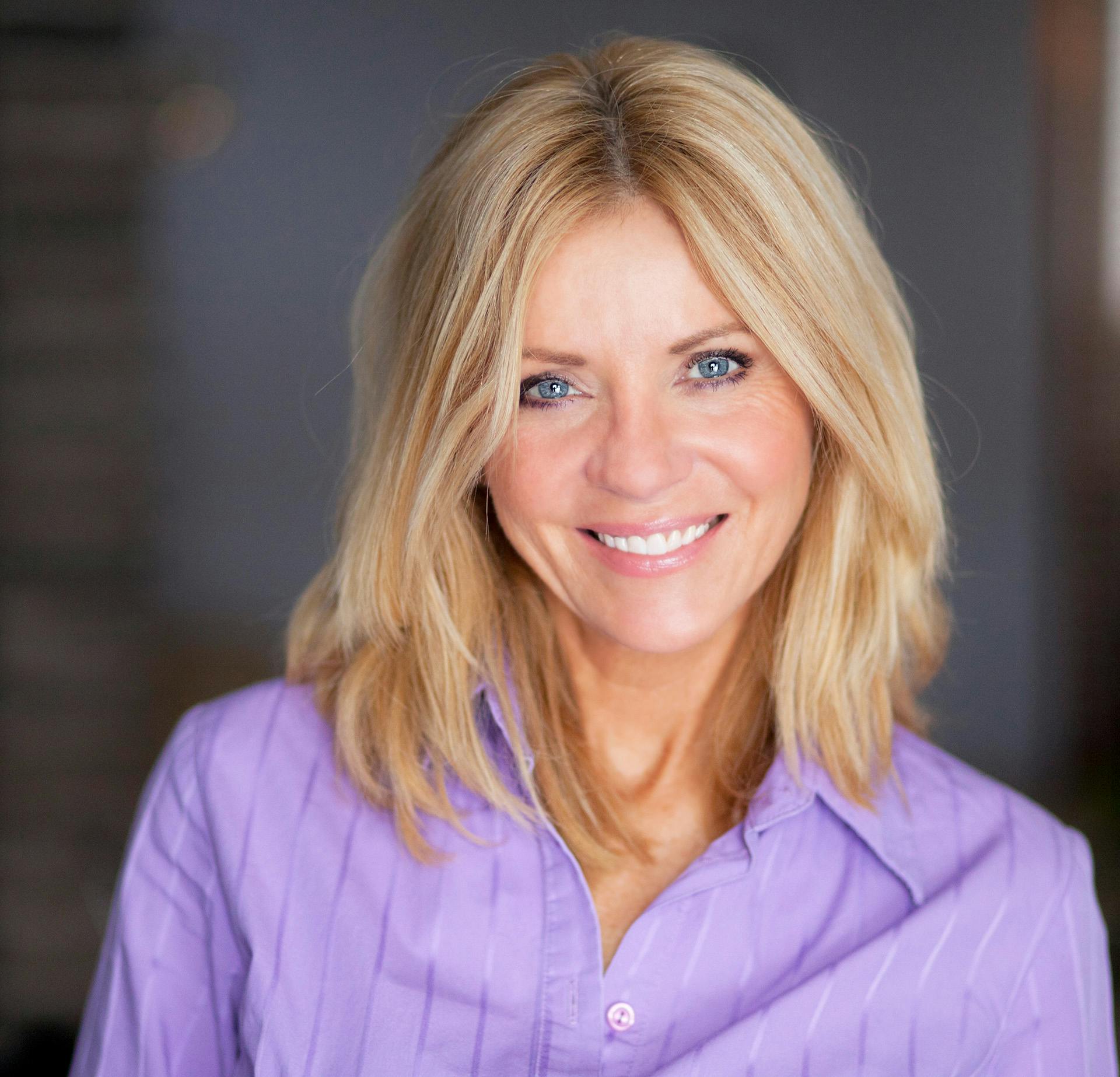 Woman with Blonde Hair and a Purple Blouse