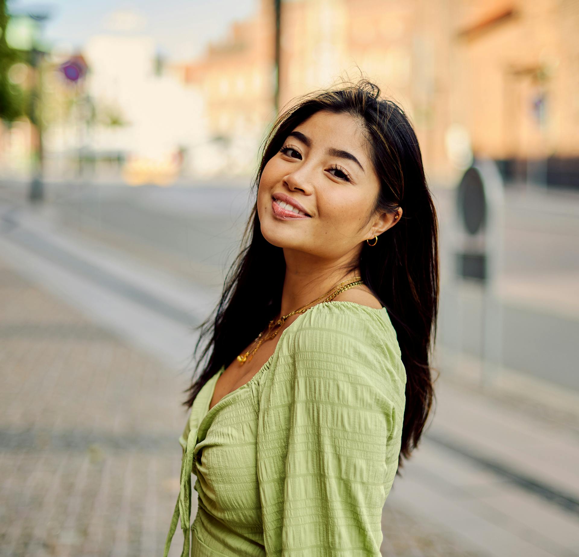 Girl in Green Dress Looking at the Camera